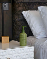 Wildheke body lotion in a calm bedroom setting for everyday skin care