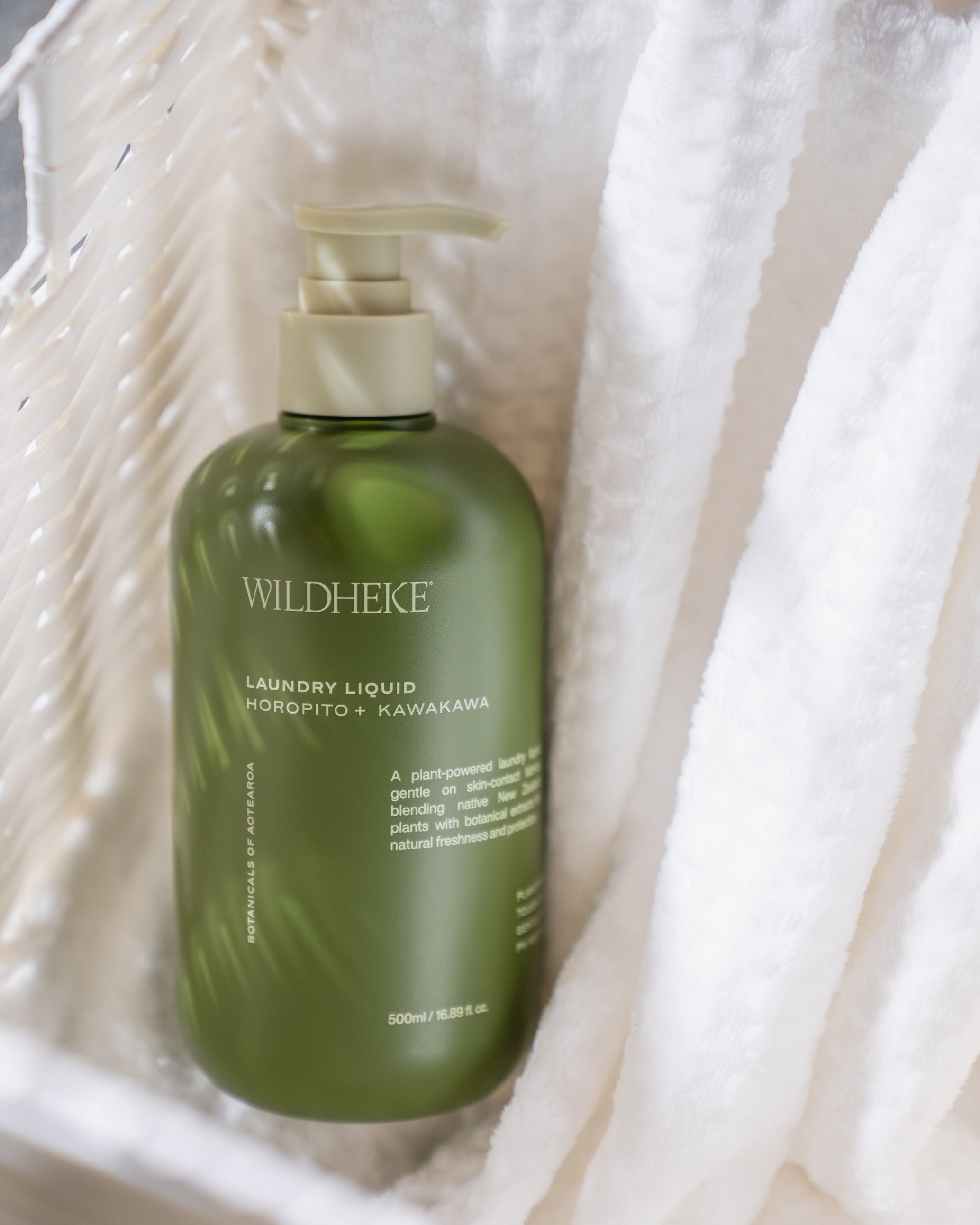 Wildheke laundry liquid with Horopito and Kawakawa in a natural home setting