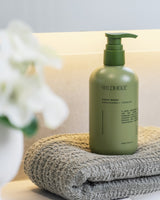 Wildheke plant-based hand wash displayed with bathroom essentials